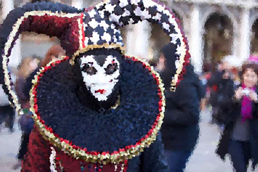Person with white skull makeup and colorful attire posing with a large decorative drum in a busy street scene.