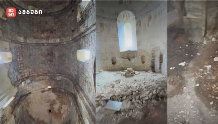 Interior of a ruined stone church with curved arches and exposed masonry.