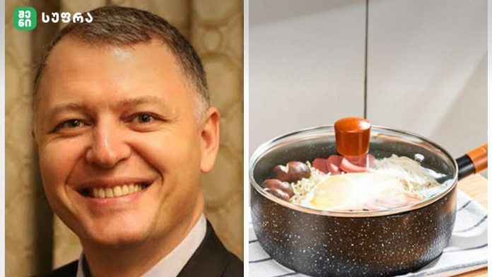 Left: smiling man in a suit (likely TV host), right: saucepan on stove with water, eggs and vegetables simmering