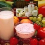Collage of fresh produce with a central milk bottle and a bowl of yogurt; inset shows jars of milk, yogurt, and butter with a red ribbon, over a background of fruits and vegetables. Brand logo with Georgian text in the top-left corner.