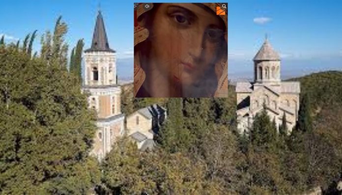 Stone church with two towers rising above a dense forest on a hillside under a blue sky; a translucent portrait overlays the center.