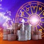Stacks of coins with upward arrows in front of a bright glowing zodiac wheel, symbolizing astrological financial growth.