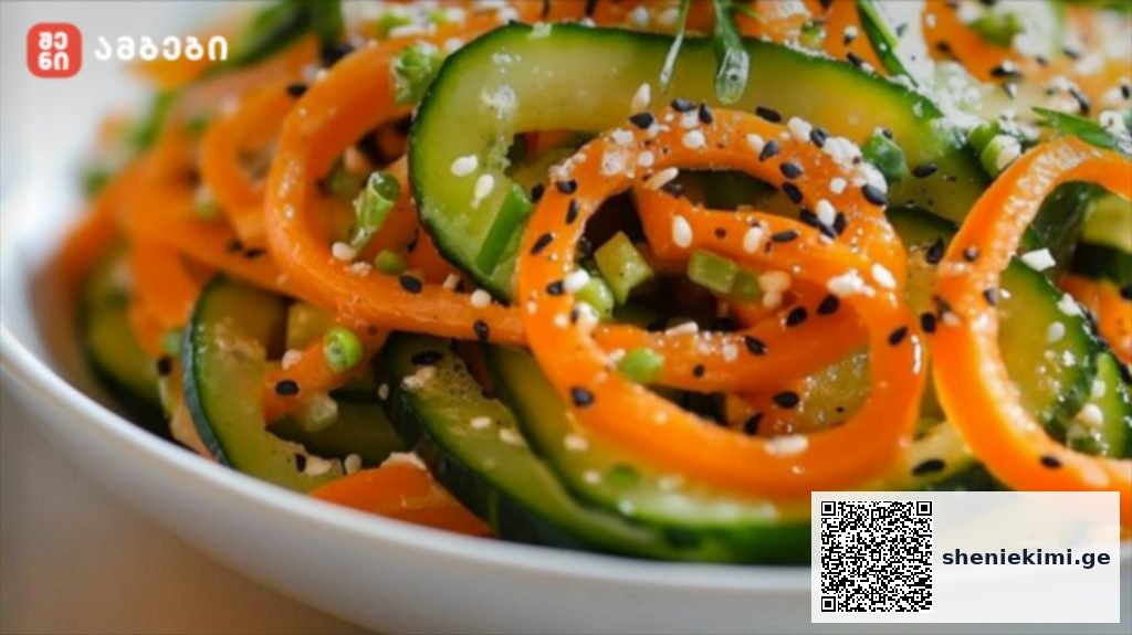 Close-up of a cucumber and carrot salad in a white bowl, topped with white and black sesame seeds.