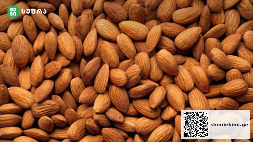 Close-up of almonds piled together, with a small green brand logo in the top-left corner.