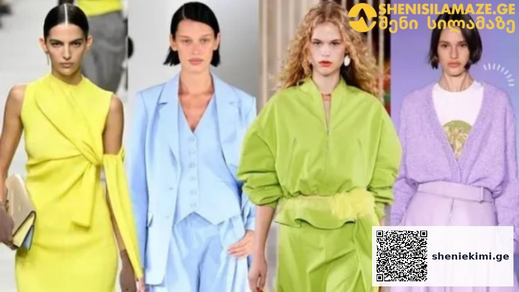 Four fashion models walk a runway in bold pastel outfits: yellow wrap dress, light blue suit, lime-green oversized ensemble, and lavender cardigan with skirt set.