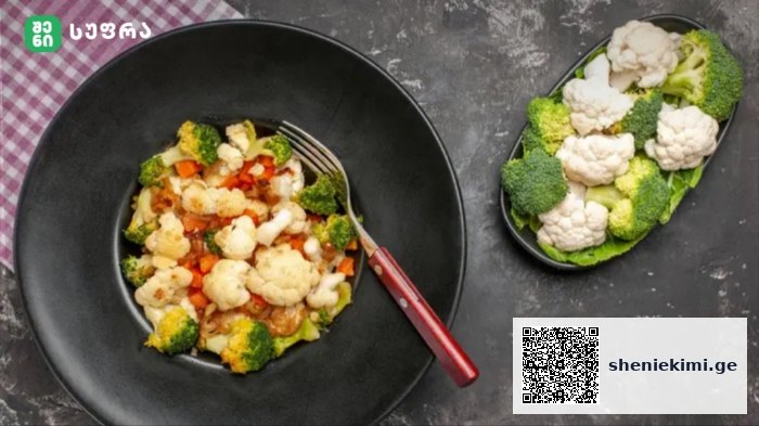 Black bowl filled with a vegetable medley (broccoli, cauliflower, carrots) and a red-handled fork; a separate plate shows broccoli and cauliflower florets.