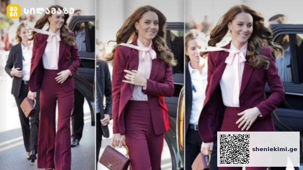 Woman in a burgundy pantsuit exits a black car, smiling, with colleagues nearby behind her.