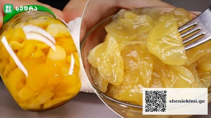 Glass jar filled with sliced yellow peaches in syrup beside a bowl of peach slices on a fork.