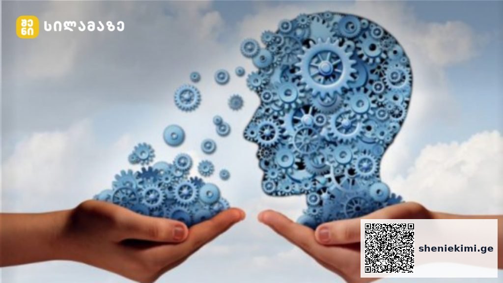 Two hands hold blue gear-filled silhouettes of a head, illustrating idea exchange or brainpower.