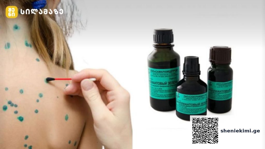 Close-up of a hand applying a green dot treat­ment on a person's back with a small brush, three dark bottles with teal labels nearby.