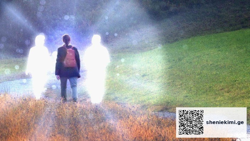 Person standing on a grassy path with two glowing translucent figures beside them in a misty outdoor scene.