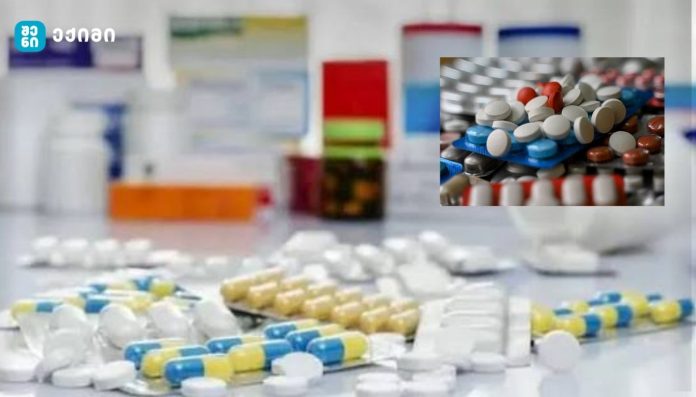 Assorted pills and capsules scattered on a lab counter with a blurred pharmacy backdrop; an inset shows pills on blister packs.